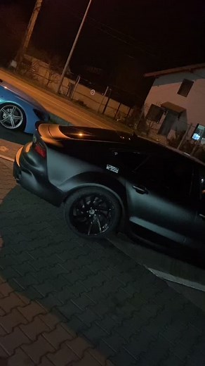 Black and Green Sports Cars Showcase at Night