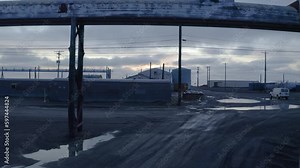 Aerial Drone shot Flying over Flooding Climate Research Center Abandoned Structures in the Thawed Permafrost Tundra near Barrow Alaska
