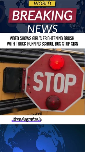 Video shows girl’s frightening brush with truck running school bus stop sign.#news