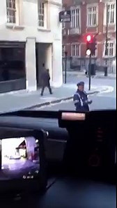 (100) Traffic warden trying to put a ticket on the window