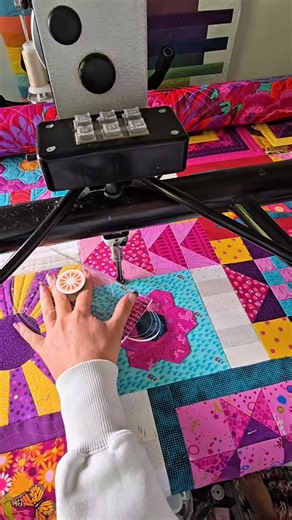 Natalia Bonner on Instagram: "Sometimes straight-line quilting is exactly what a block needs! Here I’m using the 4-N-1 Machine Quilting Ruler with our Piece N Quilt PopSocket Ruler Grip attached to the top—just enough control to add clean, beautiful texture and a little extra interest. I’ll be sharing my full process of custom machine quilting this incredible quilt soon… and trust me, you don’t want to miss it! Plus, inside the PNQ Academy, you’ll find over 150+ step-by-step quilting videos to k