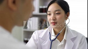 Female doctor using stethoscope to diagnose and examine male patient in hospital examination room. Healthcare and medicine consultant.