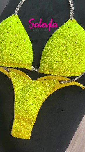 Yellow Neon: Be the brightest star on stage! ✨☀️ This dazzling competition bikini is sure to turn heads and make you feel like a million bucks. The neon yellow color is so vibrant and fun, and the rhinestones sparkle like crazy. What do you think of the Yellow Neon competition bikini? 😍 #handmadebikini #rhinestonedesign #rhinestonebikini #saleylacompetitionsuits #CompetitionBikini #SaleylaSuits | Saleyla