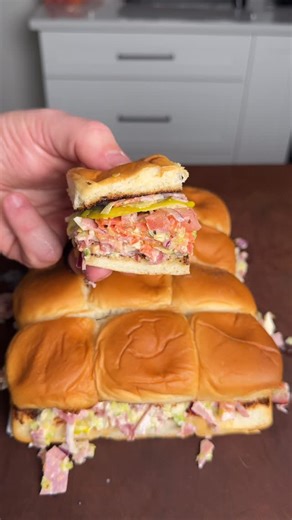 Brian Gerwig on Instagram: "2025 Top 5 Recipes - Featuring number 1: Chopped Italian Grinder Sliders Recipe⤵️ * Using @kingshawaiian rolls, cut them in half toasting them on the griddle * On a cutting board add 2 handfuls of lettuce, ham, saopprasetta salami, Genoa salami, pepperoni (or deli meats of choice) provolone cheese, red onions, tomatoes and start chopping with Montana Knife Company Cattleman Cleaver 2.0 * Once you have a good rough chop, add in mayo, hot hoagie spread, 2 Tbsp red wine 
