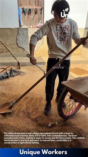 Efficient Material Handling: Man Uses Leveraged Shovel to Load Wheelbarrow