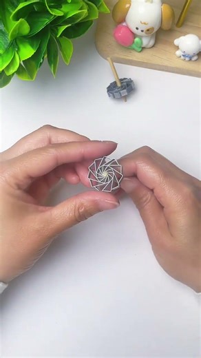 Make a spinning top out of staples—it’s simple and easy to learn Give it a try! #DIYToys