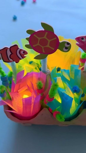 Make a light-up coral reef with us 🐢 🐠 Create your own glowing coral reef using LED tea lights, tissue paper and an old egg box. With a splash of creativity you can create an underwater world. What do you think of this under-the-sea DIY project? CRAFT IT >>> https://www.bakerross.co.uk/craft-ideas/kids/light-up-coral-reef/ #BakerRoss #eggboxcrafts #diycrafts #oceancrafts #diycoralreef #craftsforkids #kidscrafts #upcyclecrafts | Baker Ross