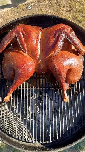 Smoking a turkey on a grill-watch how chef spatchcocks and smokes a turkey on a Weber kettle grill!