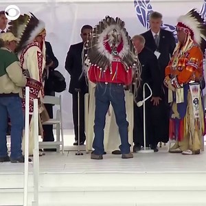 An Indigenous leader placed a traditional headdress on Pope Francis during his visit Monday to the site of a former residential school where Indigenous children suffered abuse in Canada. | CBS News