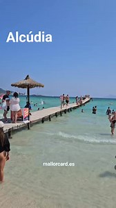 A Perfect Summer at Playa de Alcudia – Where the Sea Shimmers in Turquoise There’s a place on Mallorca where the sea sparkles like crystal, the sand feels like soft white powder beneath your feet, and the sun paints everything in golden light — welcome to Playa de Alcudia. This summer, the beach is more breathtaking than ever. The turquoise waters stretch endlessly before you, calm and inviting, perfect for a swim, a paddle, or simply floating and letting time slow down. Families laugh, couples 