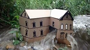 Cardboard house built by a river.
