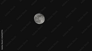 Moon Timelapse, Stock time lapse : Full moon rise in dark nature sky, night time. Full moon disk time lapse with moon light up in night dark black sky. High-quality free video footage or timelapse