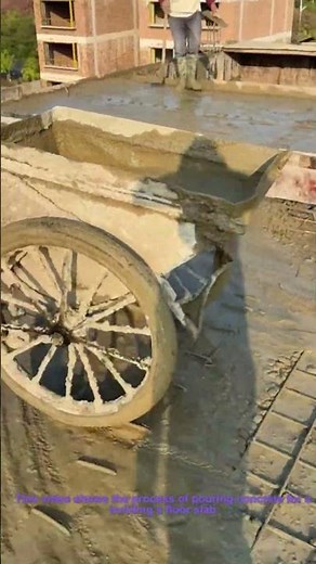 Floor Concrete Pouring: Workers Moving Fresh Concrete for Building Slab Construction