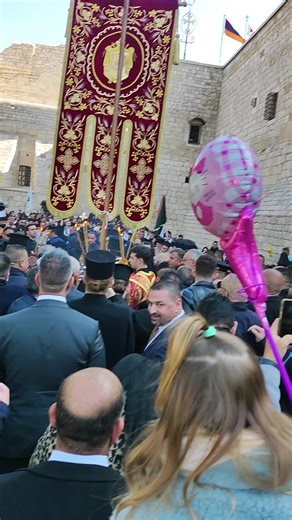 Religious Ceremony Gathering with Flags and Banners