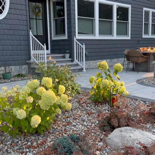 Superior Hardscapes on Instagram: "Creating spaces for your family to enjoy forever- enjoy cooking, relaxing, reading, connecting with friends and family for years to come. Featuring the #coolcolonialproject and @unilock @kuertoutdoorliving Border in Copthorne, Steel Blue complimented by Beacon Hill pavers in “Random” pattern, the color “Fossil” (the larger paver laying flat) and the seat wall, outdoor kitchen island and fire table are @unilock Quarry Smooth in Gray. What’s your favorite spot on
