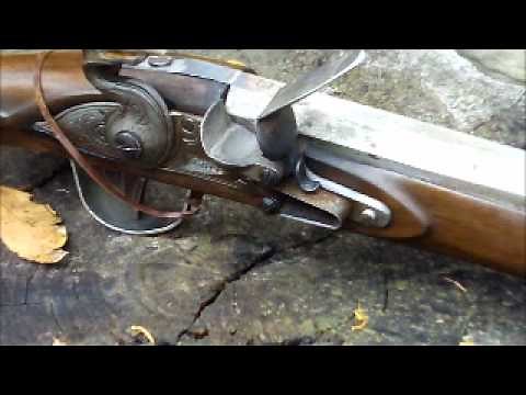 Knapping A Sharp Edge On A Flint To Make Fire.