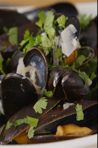 Chai-steamed mussels with butter, lime, and coriander