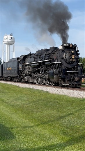 Nickel Plate Road 765 is a restored excursion steam locomotive based in Fort Wayne, Indiana and cared for by the Fort Wayne Railroad Historical Society. The locomotive pulls several public passenger excursions each year. Some of the most popular are the Tristate Steam Excursions, operating from Edon, Ohio to Hillsdale, Michigan and return. In this scene from June of 2025, 765 returns south to Edon, passing through the town of Angola, Indiana. #steamlocomotive #travel #transportation #railroad #n