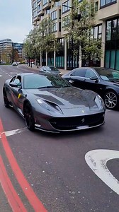 Grey Ferrari blends with the city