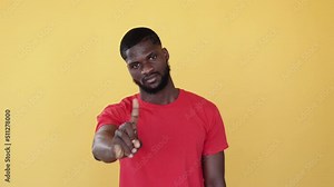 Stop racism. Black lives matter. Ethnic equality. Blm tolerance. Boomerang animation. Unhappy african man warning with no finger gesture gif loop isolated on orange copy space.