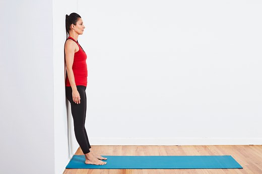 Use the Pilates Wall Roll Down to Correct Your Posture