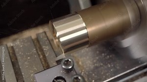 Thread cutting with oil lubrication, machine metalworking. Metal screw at grommet production line. Screw-thread. Automated Process at the Modern Steel Manufacture Plant.