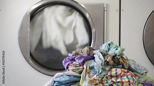 Washing machines in laundry room with rotating drums