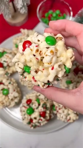 8.7K views · 42 reactions | ✨ These Easy Marshmallow Popcorn Balls are gooey, crunchy, and bursting with color! Perfect for kids, parties, or a fun holiday snack!  #holidayrecipes #christmastreats #popcornballs #festivesnacks #sweetandsalty #holidayfun #easydessert #holidaybakes #homemadetreats #snacktime #kidfriendlyfood #christmasdessertideas #snackideas #christmasfun #holidayvibes | Mama Recipes Book | Facebook