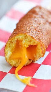 This irresistible Cheese On A Stick recipe make gooey, melted cheese coated in a sweet, honey flavored cornmeal batter that is fried to golden perfection. #cheeseonastick #cheesestick #cheesy #statefair #friedfood #thegunnysack #countyfair #deepfried | The Gunny Sack