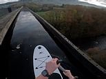 'Crazy' YouTuber Ally Law learns to paddleboard on 126ft-high aqueduct in 2C