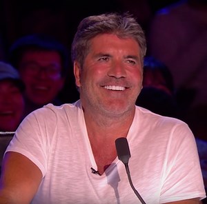 Britain's Got Talent judge Simon Cowell has pressed his Golden Buzzer for comedian Kojo