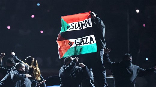 Super Bowl halftime performer detained for Palestine & Sudan flag protest