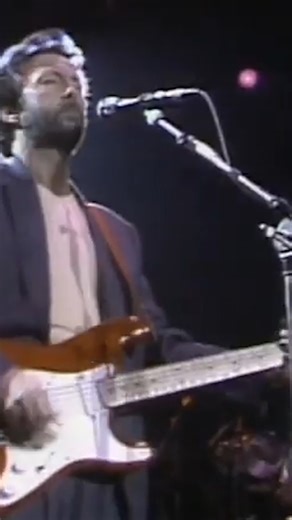 Phil Collins was born in January of 1951. This July 1986 performance of "White Room," featuring Collins on the drums, is taken from NEC Birmingham in Birmingham, UK; the concert would eventually be released on VHS and DVD as 'Eric Clapton & Friends.' | Eric Clapton