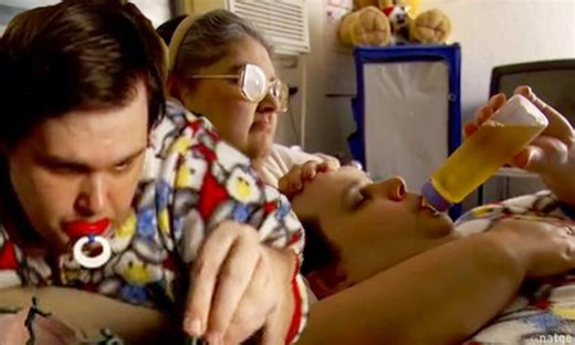 The 'adult baby': Man who wears diapers, sleeps in a crib and is bottle-fed... at 30