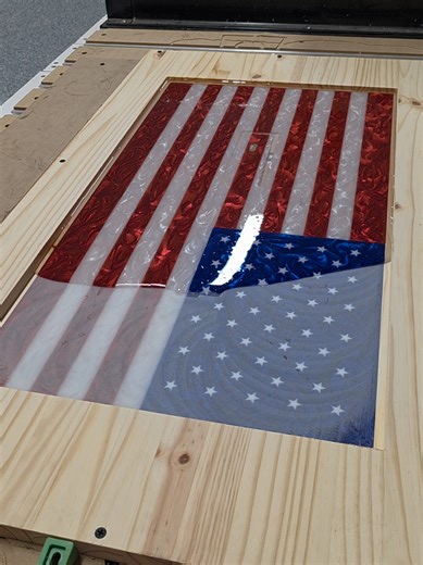 Here's a little more insight to this build because I've had a LOT of questions. After doing the flag on the face, I flipped the piece over to pocket out the wood on the back. When doing so, my bit dropped not once, not twice, but three times right through the face. So as you can see, I had to repair some of the stripes. Which did work however because I used a little too much pigment within those stripes, the LED aspect went out the window unfortunately. Still have an amazing looking flag in the