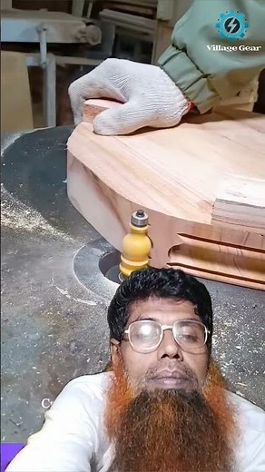 Witness the focused skill of a woodworker using a router table to create intricate edge details.