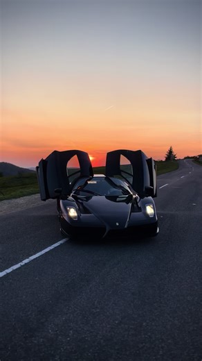 Breathtaking Sunset with a Black Ferrari Enzo