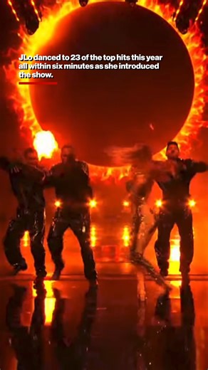 Jennifer Lopez kicked off this year's AMAs by sharing a steamy smooch with her backup dancers. 💋 | New York Post