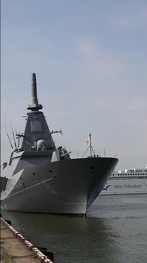 The destroyer escort Agano FFM-6 is anchored at Niigata West Port, with Shin Nihonkai Ferry enter...