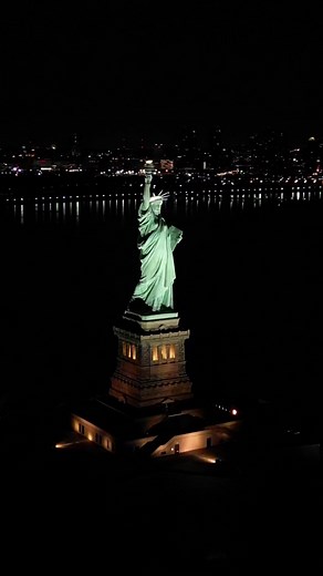 Drone Footage of Statue of Liberty at Night in NYC