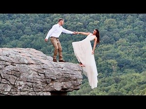 Newlyweds Dangle From Cliff for Wedding Photo