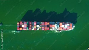 4K resolution high angle view of a container ship sailing at the sea for transportation.