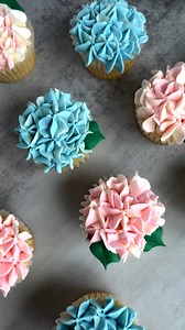 1.8K views · 42 reactions | Surprise your mom this Mother's Day by whipping up something unique in the kitchen. Take inspiration from these gorgeous cupcakes that resemble hydrangea flowers, created by the talented The Squeaky Mixer. Not only are they visually stunning, but they also taste heavenly! Your mom will definitely appreciate the effort you put into making something special for her. https://bit.ly/Floral-Cupcakes | Harris Teeter | Facebook