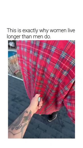 GLOBAL REEL HUB on Instagram: "The post features a 13-second video of a man in a red shirt igniting himself on a roof before leaping into a small inflatable pool below, captioned with a quip linking such reckless stunts to men's shorter lifespans compared to women. Posted by @HumansNoContext , an account specialising in sharing bizarre, context-free clips of human behaviour, this garnered over 449,000 views and 79 replies mocking the danger, from superhero comparisons to warnings against imitati