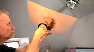 This artist creates incredible paintings with fire