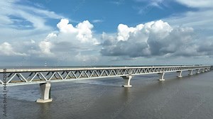 Aerial view of The Padma Multipurpose Bridge, the largest bridge, over the Padma river by day in perspective, Mawa, Munshiganj, Bangladesh.
