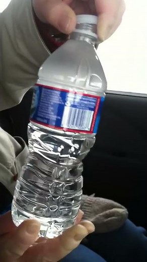 Watch the water freezing in bottle when bottle is opened!