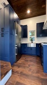 Could you live in this 360-sqft "Doodle House" custom park model tiny home? What would you add or change? This tiny house is built by the talented team at Movable Roots for a couple and their two golden doodles! There's a beautiful U-shaped kitchen with apartment-size appliances, a breakfast bar for 2, & tons of storage; a living room with space for a sectional couch & a mounted TV; a downstairs private bedroom; 2 bedroom lofts (or for storage); & a beautiful large bathroom with a washer & dryer