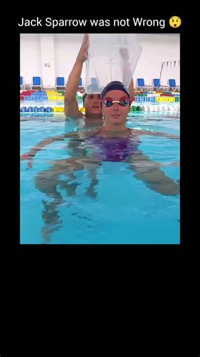 English Meme Daily on Instagram: "In this video, a woman dips underwater with an upside-down bucket placed over her head, creating a pocket of trapped air that allows her to breathe while submerged. The simple trick works because of basic physics — specifically air displacement and pressure balance. When the bucket is pushed underwater, the air inside cannot escape, so it forms a sealed bubble. Water pressure pushes up from below, but the trapped air keeps the space inside breathable (for a shor