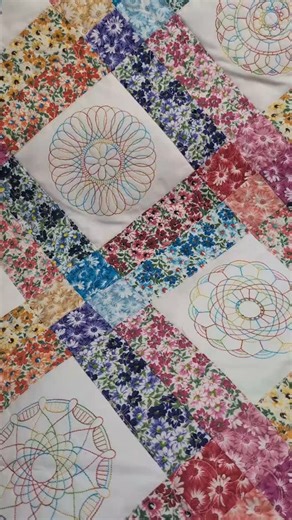 Christen | ISeeStarsQuilting on Instagram: "This one is all about the stitching 🌸✨ Layered florals, flowing lines, and threadwork that adds movement and depth without overpowering the fabric. Every pass of the needle feels intentional. Soft. Confident. This is the kind of quilting that rewards a second look. And maybe a third 👀🧵 I could watch these stitches dance all day 💕 #iseestarsquilting #quiltingcommunity #quiltersofinstagram #modernquilting #quiltinglife #quiltinglove #longarmquilting